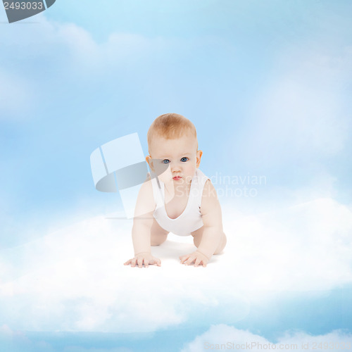 Image of smiling baby sitting on the cloud