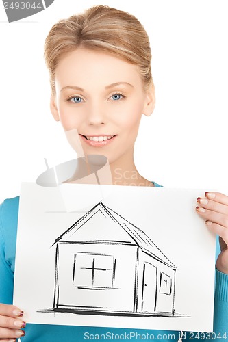 Image of woman holding picture with house