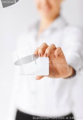 Image of businesswoman showing blank card