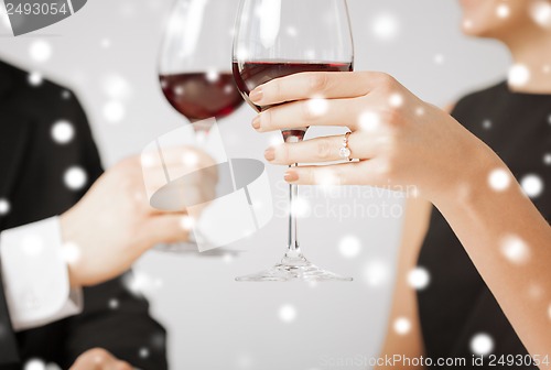 Image of engaged couple with wine glasses