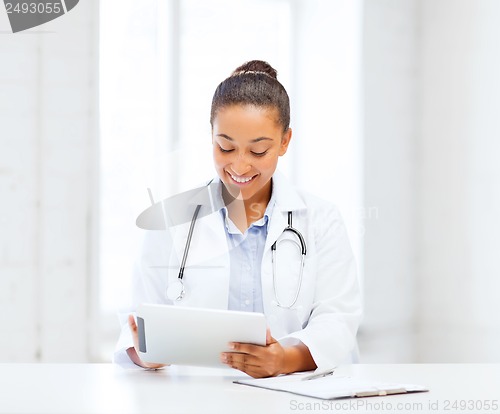 Image of african female doctor with tablet pc