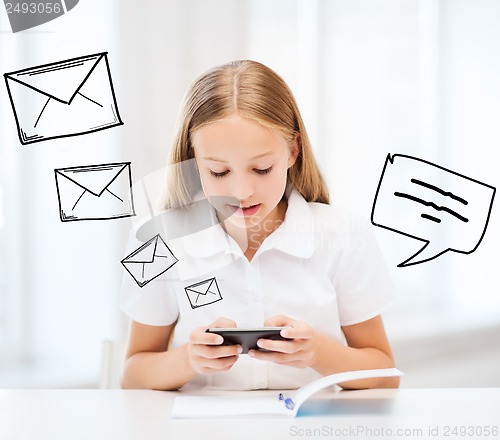 Image of girl with smartphone at school