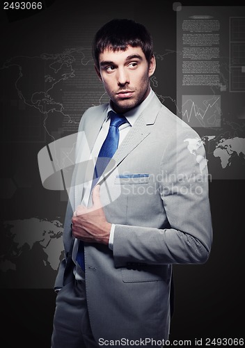 Image of buisnessman with virtual screens