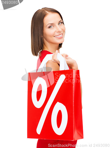 Image of woman in red dress with shopping bags