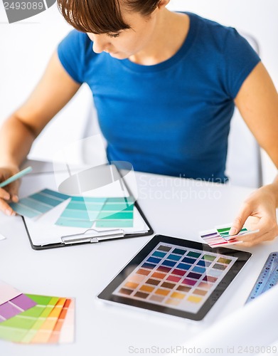 Image of woman working with color samples for selection