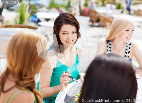 Image of girls in cafe on the beach