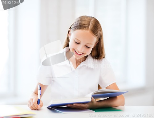 Image of student girl studying at school