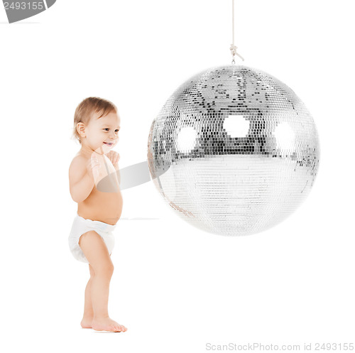 Image of toddler playing with disco ball