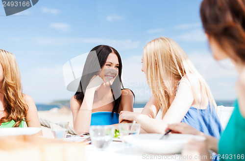 Image of girls in cafe on the beach