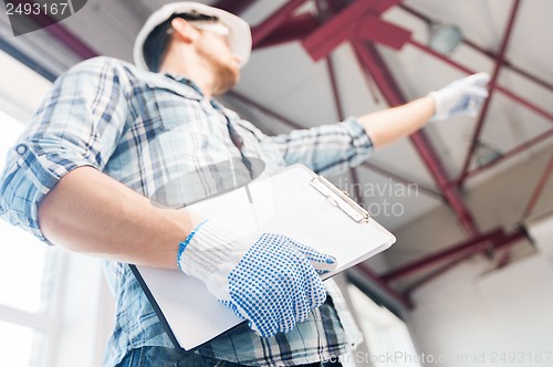 Image of man with blueprint