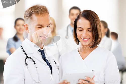 Image of two doctors looking at tablet pc