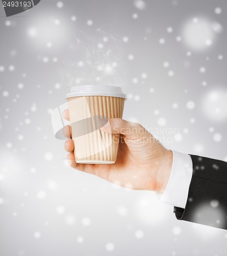 Image of man hand holding take away coffee