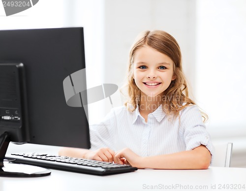 Image of student girl with computer at school