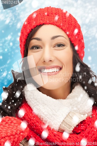 Image of woman in hat, muffler and mittens