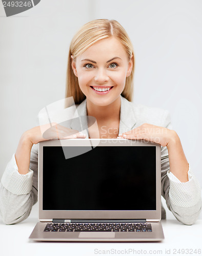 Image of smiling woman with laptop pc