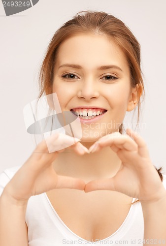 Image of woman showing heart shape