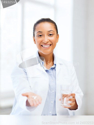 Image of doctor with offering pills