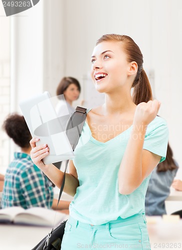 Image of happy student girl with tablet pc