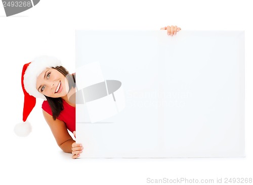 Image of woman in santa helper hat with blank white board