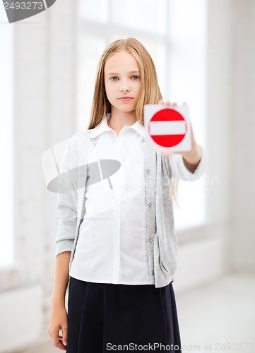 Image of girl showing stop sign