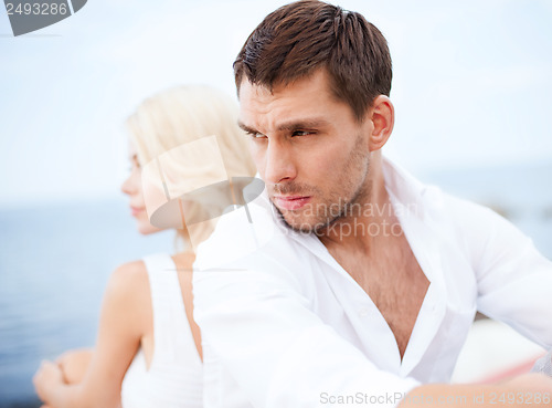 Image of stressed man with woman outside