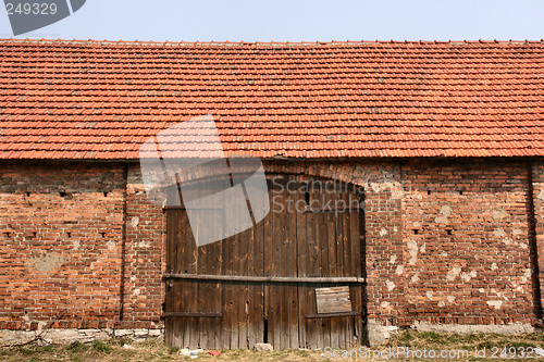 Image of Old brick barn with wooden gate