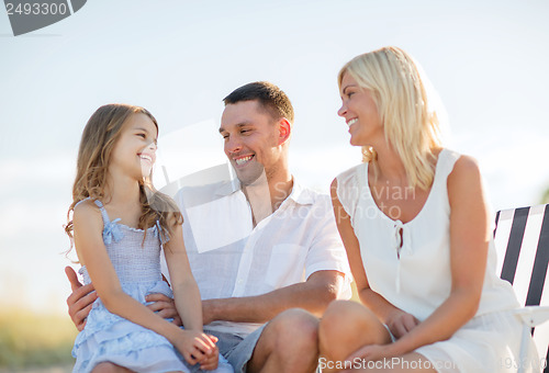 Image of happy family having a picnic