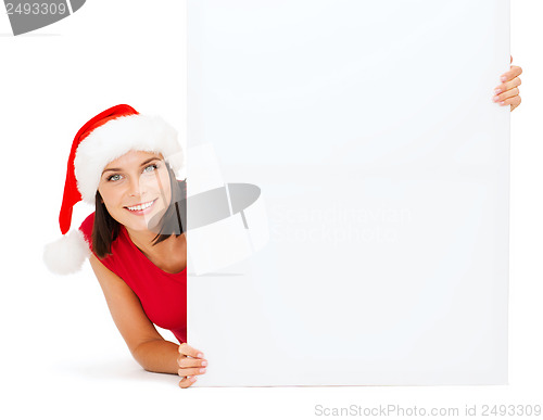 Image of woman in santa helper hat with blank white board