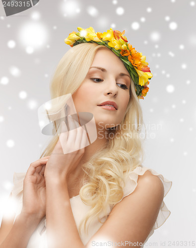 Image of woman wearing wreath of flowers