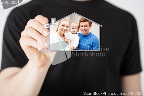 Image of family with child and dream house