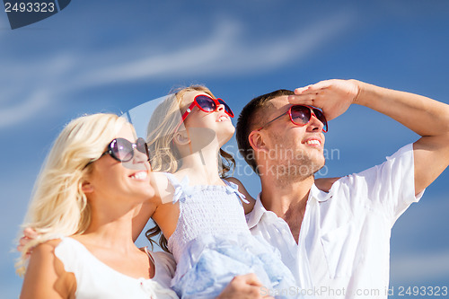 Image of happy family with blue sky