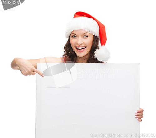 Image of woman in santa helper hat with blank white board