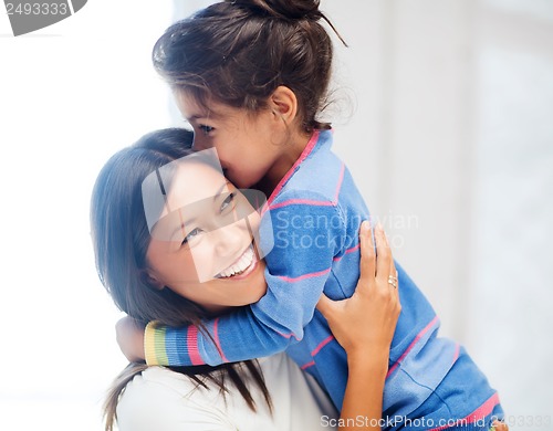 Image of hugging mother and daughter