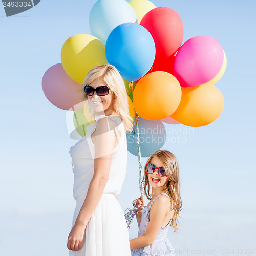 Image of mother and child with colorful balloons