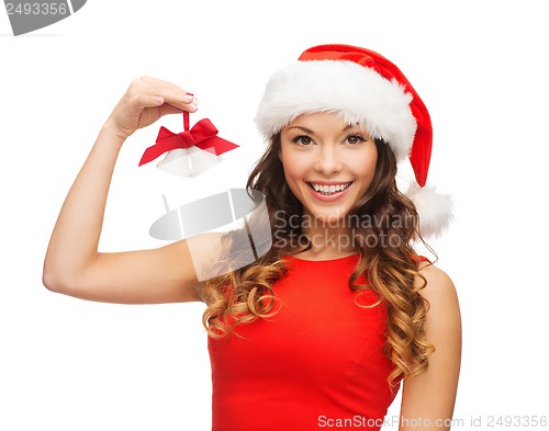 Image of woman in santa helper hat with jingle bells