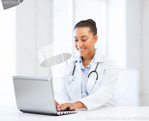 Image of female doctor with laptop pc