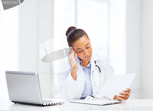 Image of female doctor with laptop pc