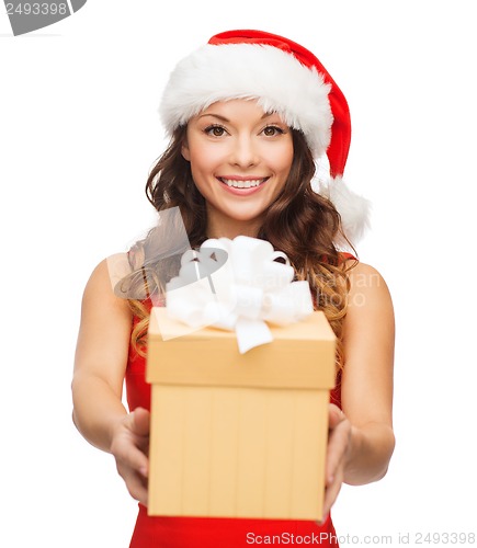 Image of smiling woman in santa helper hat with gift box