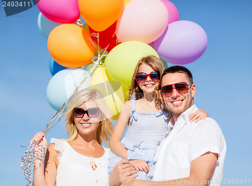 Image of family with colorful balloons