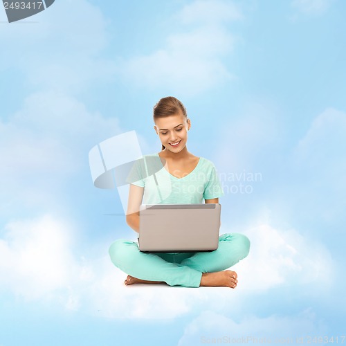 Image of woman sitting on the cloud with laptop