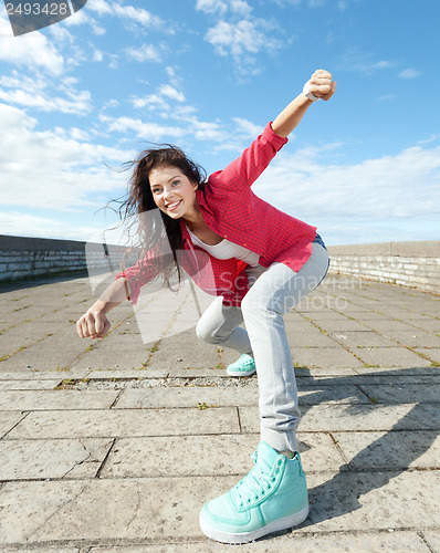 Image of beautiful dancing girl in movement