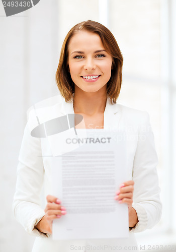 Image of businesswoman holding contract