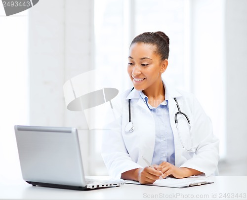 Image of female doctor with laptop pc