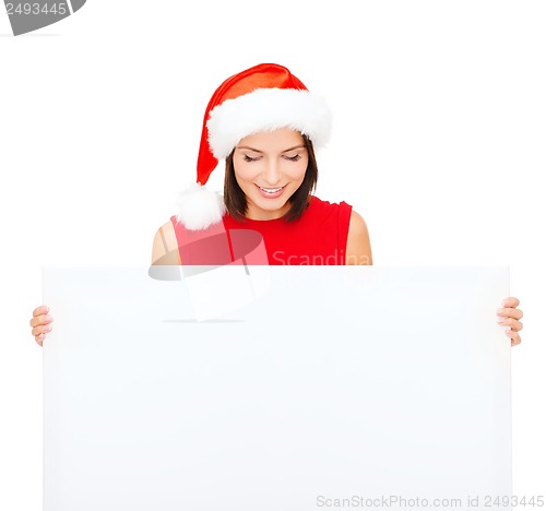 Image of woman in santa helper hat with blank white board