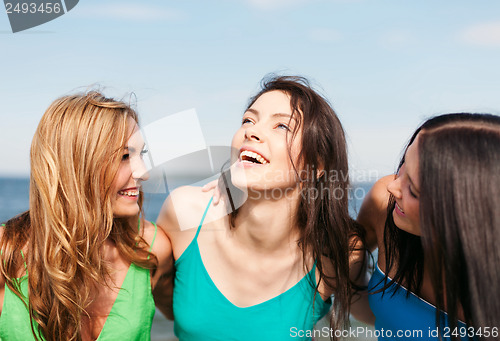 Image of girls walking on the beach