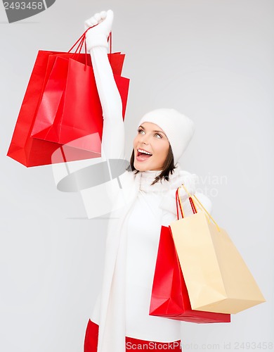 Image of picture of happy woman with shopping bags