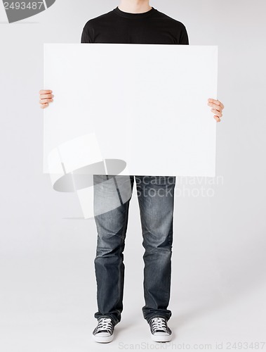 Image of man showing white blank board