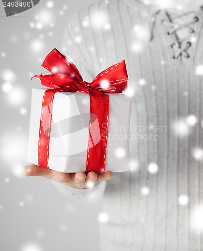 Image of man holding a gift box