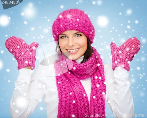 Image of woman in hat, muffler and mittens