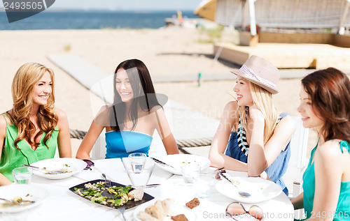 Image of girls in cafe on the beach